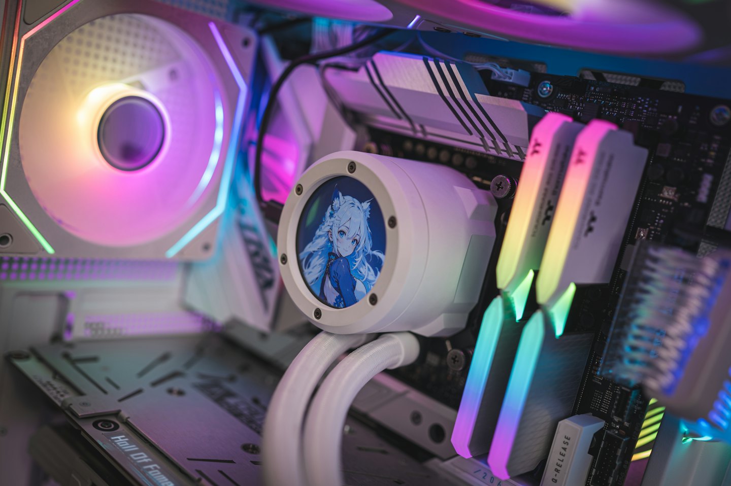 Internal components of a custom gaming computer with a digital display.