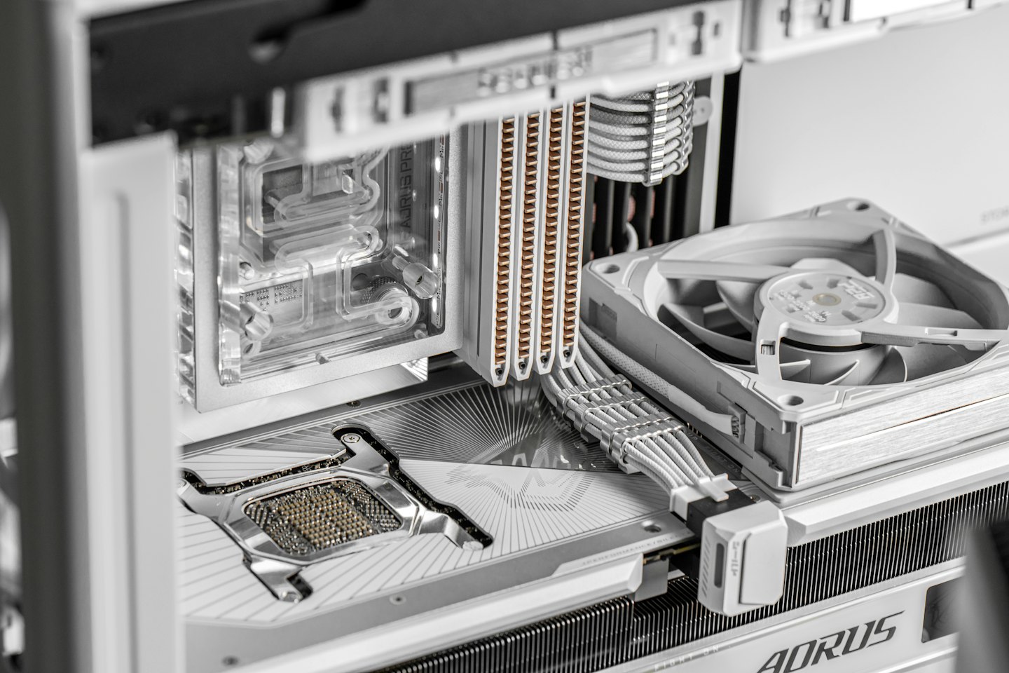 Custom computer motherboard with cooling components and intricate wiring.